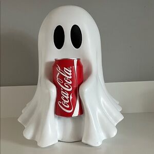 Ghost holding Coca Cola Red Can with White Ghost Holder